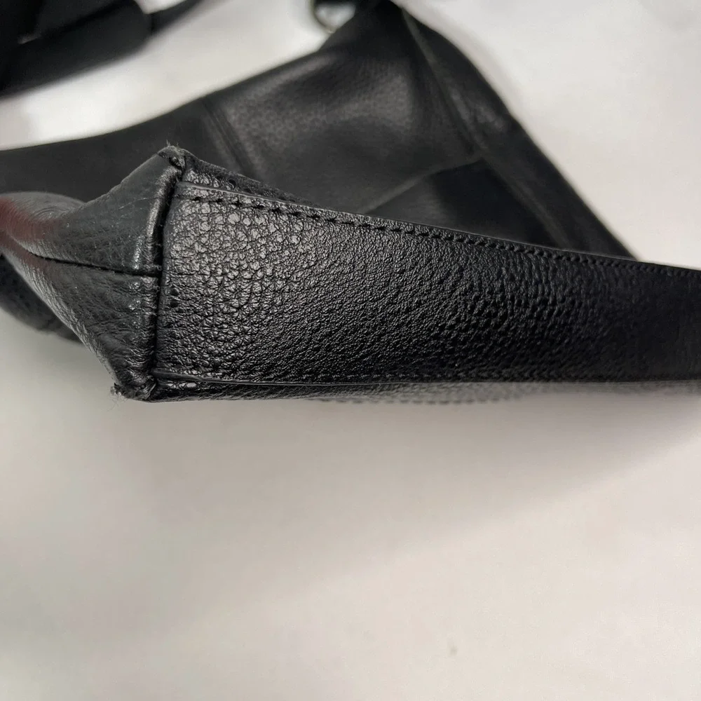 The Sak Crossbody Black Genuine‎ Leather Tooled Embossed Purse Tassels